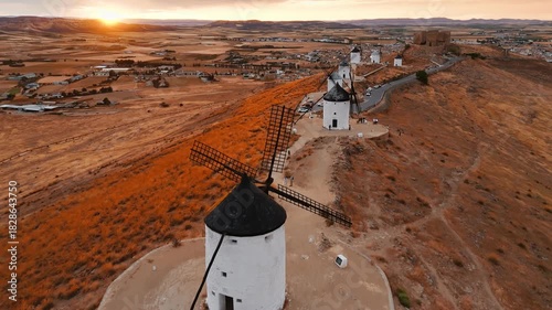 Aerial view of the windmills of Consuegra at sunset, Castilla-La Mancha, Spain.