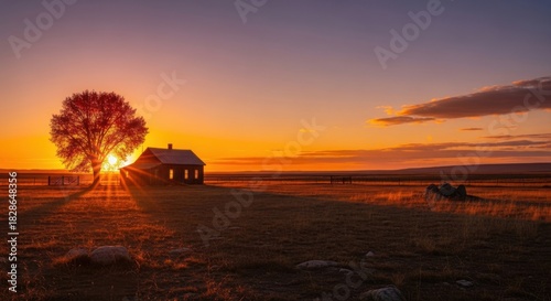 Dramatic Sunset Light Illuminating a Rural House and Tree