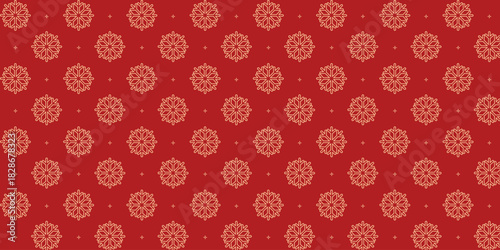 Elegant seamless pattern with golden snowflakes and tiny stars on a rich red background, perfect for Christmas wrapping paper, festive textiles, greeting cards, invitations and seasonal holiday design