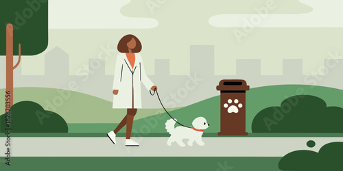 Woman walking her dog in the park on a leash