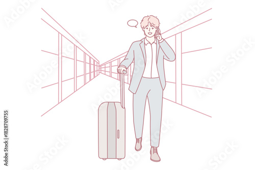 man walking through airport corridor with suitcase, on phone making business call, formal suit and rolling luggage, glass windows and tiled floor, purposeful stride toward gate, travel