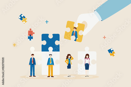 Hand placing a puzzle piece with a businessman into a larger puzzle representing teamwork and talent acquisition