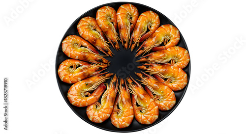 Fresh cooked shrimp arranged in a circle on a black plate on transparent background