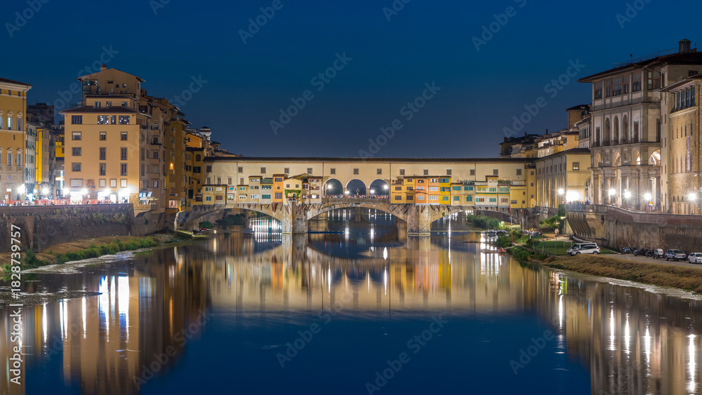 Fototapeta premium River Arno and famous bridge Ponte Vecchio day to night timelapse after sunset in Florence, Tuscany, Italy