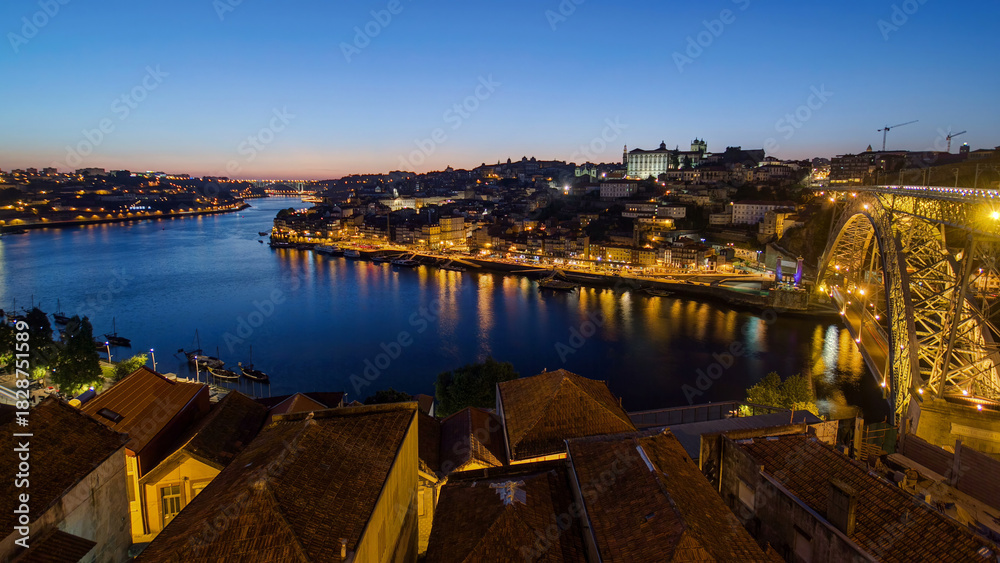 Obraz premium Panorama of old city Porto at river Duoro after sunset day to night timelapse, Oporto, Portugal