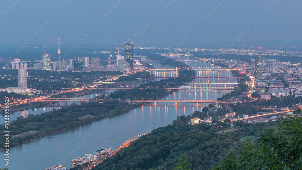 Fototapeta premium Skyline of Vienna from Danube Viewpoint Leopoldsberg aerial day to night timelapse.