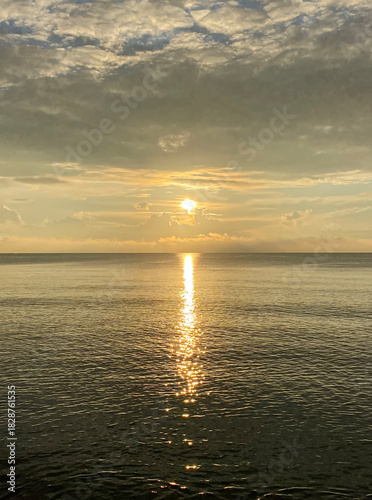 Golden Sunset Over Calm Sea Horizon