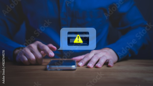 Person holding smartphone with warning message, symbolizing online payment error, digital banking security risk, scammer, and financial fraud prevention. Credit card alert notification concept.