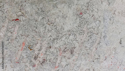 Close up of a weathered and cracked gray concrete surface