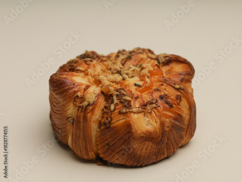 Danish pastry with savory filling on white background