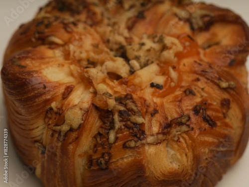 Danish pastry with savory filling on white background