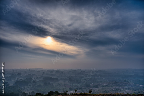 HDR images of an early morning forest surrounded by fog with a sunrise view