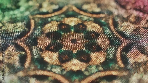 Intricate Textile Pattern: This captivating macro shot unveils the exquisite detail of an antique textile design.