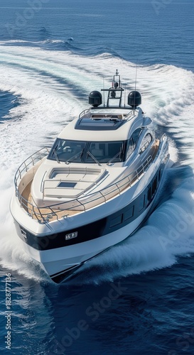 Luxury motor yacht speeding through blue ocean waves