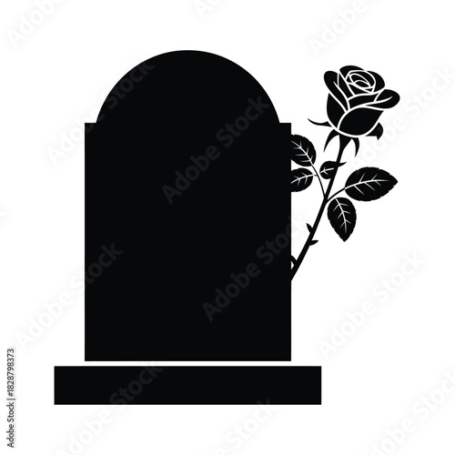 Silhouette of a tombstone with a rose and leaves