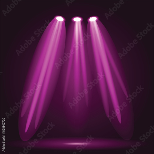Three bright pink spotlights illuminate a dark stage creating a dramatic effect