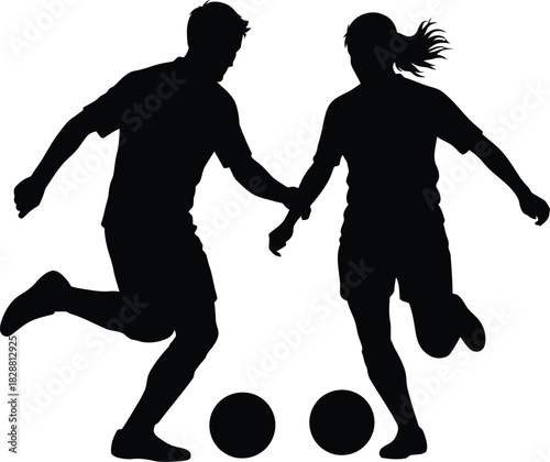 Silhouette of a male and female soccer player kicking balls