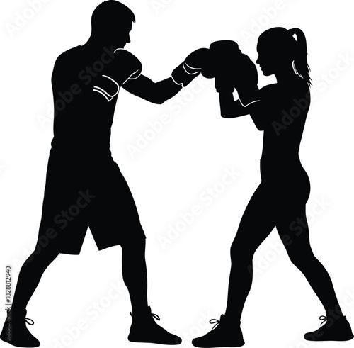 Silhouette of boxer and trainer sparring in a boxing gym