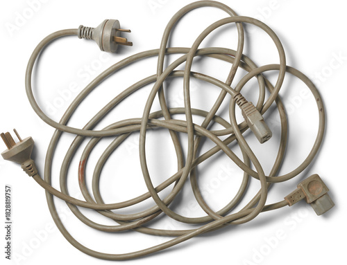 Obraz na płótnie tangled heap of three-pronged electrical power cords, muted gray cables with plu
