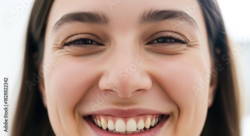 Joyful woman with a wide genuine smile