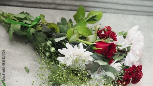 A flower bouquet is a beautifully and carefully arranged of flowers, typically used as a decoration or gift. A florist assembles a bouquet from various types of flowers. A gift is a life event.