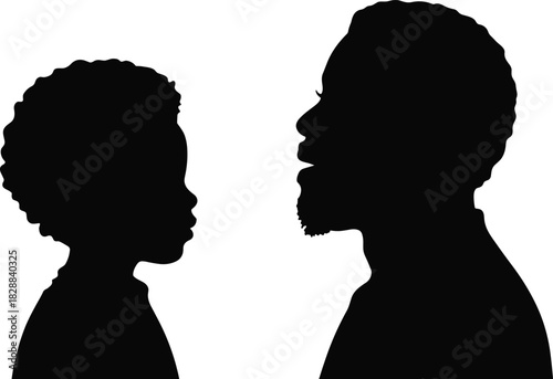 Silhouette of African-American father and son looking at each other, symbolizing bonding, generations, family, childhood, love, isolated, black, white, profile