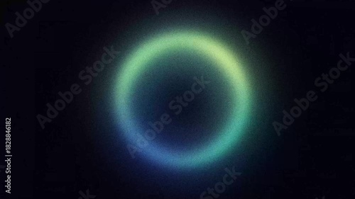 Abstract pulsing ring shape with grainy green, blue and yellow gradient, animated looping background with noise texture