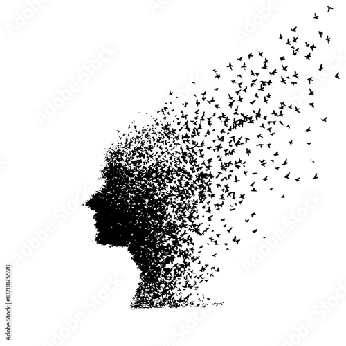 Silhouette of human head dissolving into flock of bird