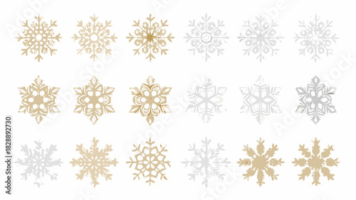Assorted collection of delicate golden and silver snowflakes on a white background