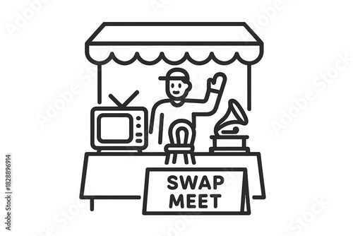 Vendor standing behind a market stall selling antique electronics and vintage goods at a flea market