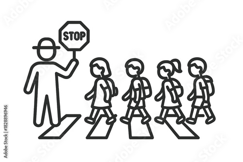 School crossing guard holding a stop sign supervising students walking across the crosswalk