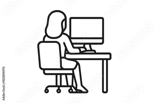 Person focused on work using a desktop computer monitor and keyboard at a desk