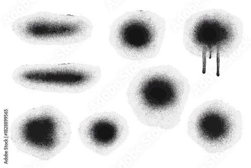 Black spray paint spots and airbrush texture elements on white background