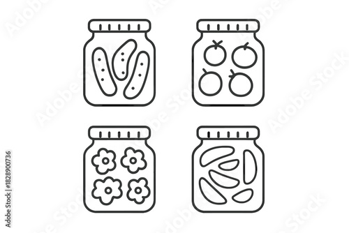 Set of glass jars filled with preserved pickles tomatoes flowers and sliced fruit