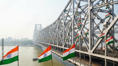 Howrah Bridge adorned with tricolor flags, a vibrant Indian landmark on independence day