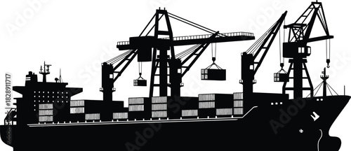 Silhouette of a cargo ship being loaded