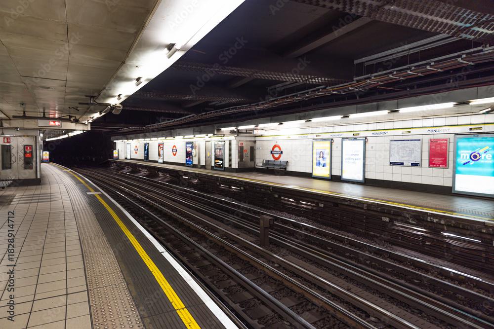 Fototapeta premium Defocused View of Empty London Tube Station Platform. London, UK, 10 December 2023
