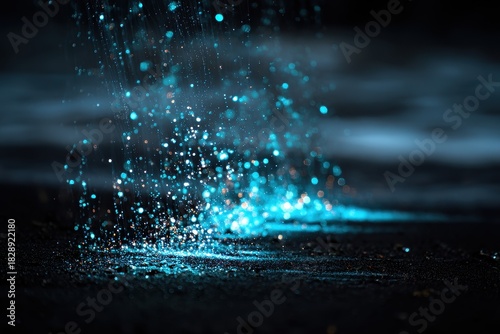 Mystical Cascade of Luminous Blue Stardust on a Glistening Surface.