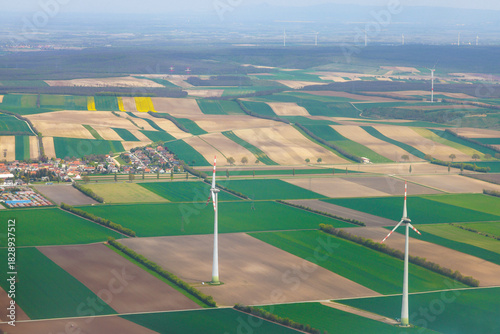 Aerial view wind turbines among agricultural fields highlighting renewable energy use in rural areas Vienna, Austria