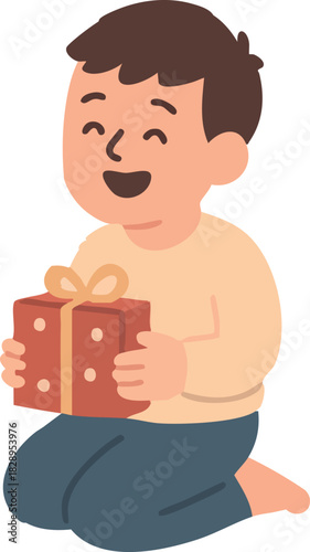 A happy young boy kneels on the floor, smiling brightly as he holds a wrapped Christmas present with a ribbon.