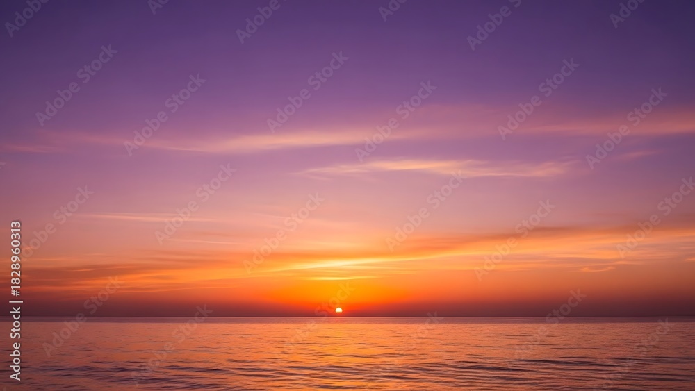 Naklejka premium Beautiful Sunset Over Calm Ocean with Vibrant Purple Orange Sky