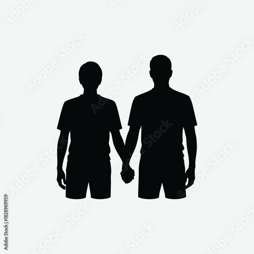 Silhouette of two men holding hands standing together in love