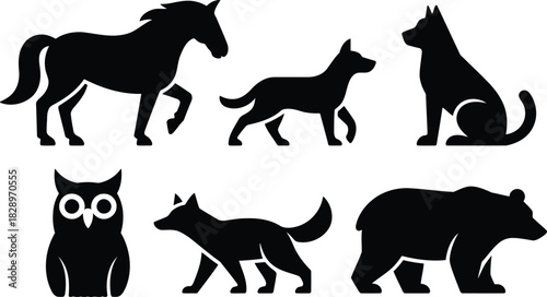 Black silhouettes of various wild and domestic animals standing and sitting on a plain white surface