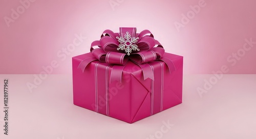 A pink gift box with a snowflake on top for a special occasion