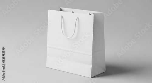White paper bag with handles isolated on white background for shopping