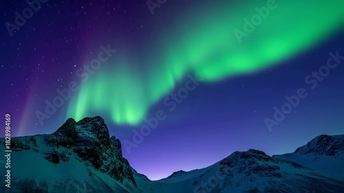 Majestic Aurora Borealis Display Over Snow-Capped Mountains in the Arctic.