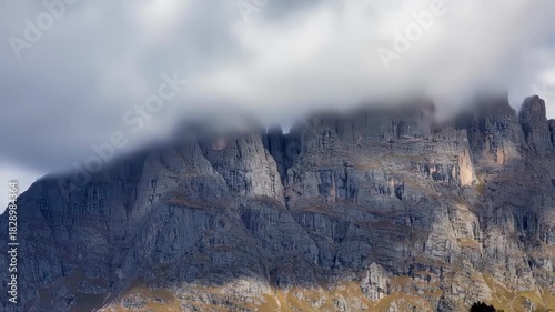Majestic Mountain Peaks Under Cloudy Skies A Stunning Landscape View.