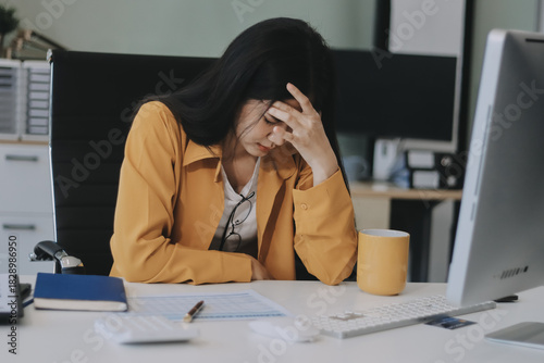 Headache, business woman at night and computer stress while working for a deadline with pc glitch. Sad corporate manager with anxiety about target working at desk screen late to complete task online