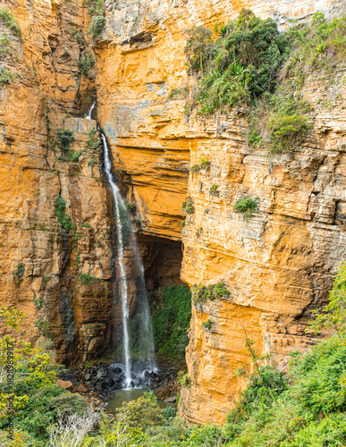 Dramatic Waterfall Cascading Down Sheer Yellow Sandstone Cliffs in Boyacá, Colombia