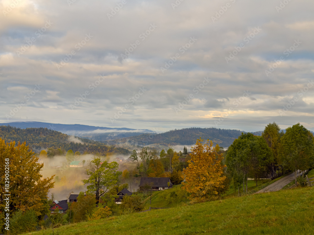 Obraz premium Misty Autumn Rain Clouds over Ukrainian Carpathian Mountains.